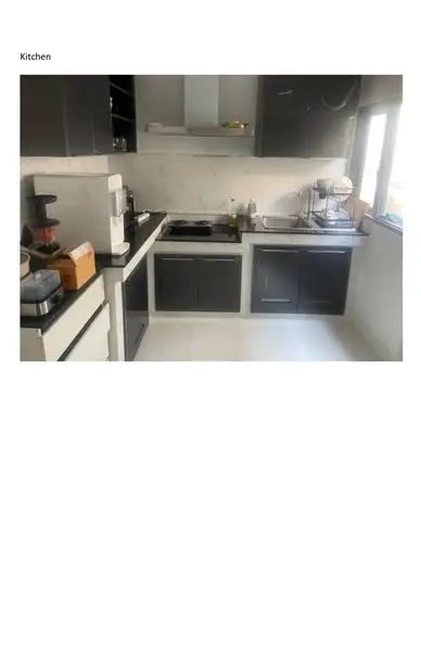 Modern kitchen with sleek cabinets and appliances, featuring a clean and functional design.