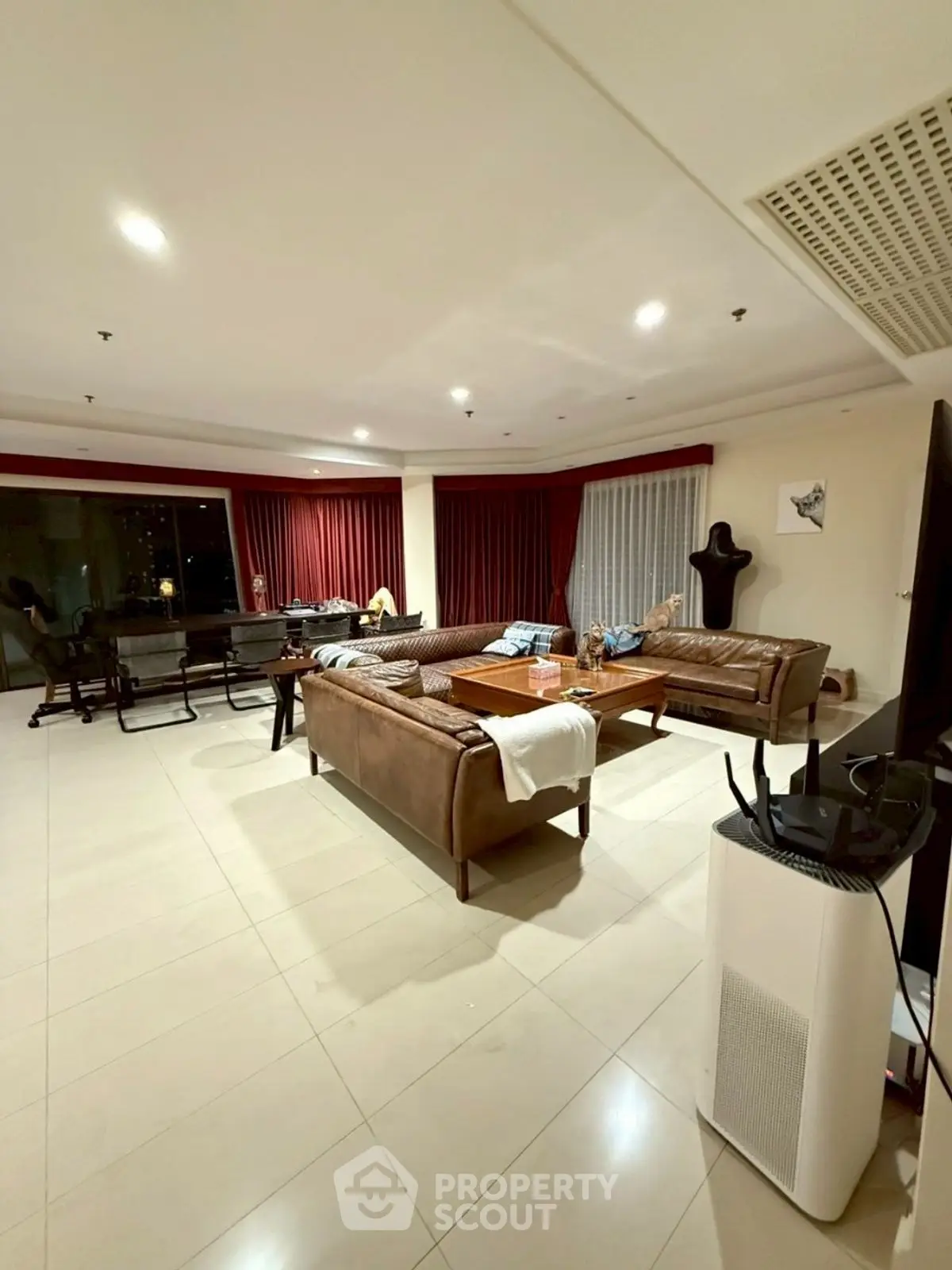 Spacious living room with modern furniture and large windows for natural light.