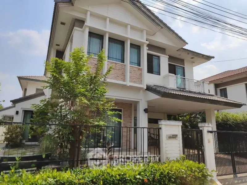 Charming two-story house with lush garden and modern design in a serene neighborhood.