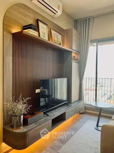 Modern living room with stylish TV unit and balcony view