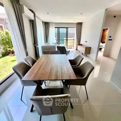 Spacious modern dining area with garden view in luxury home