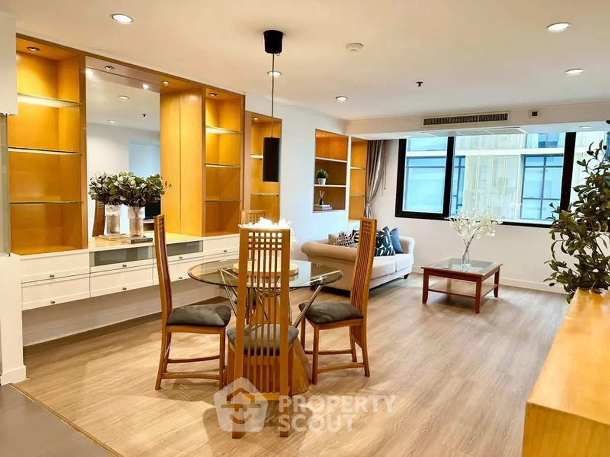 Spacious modern living room with elegant dining area and natural light