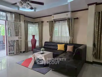 Spacious living room with modern decor and natural light