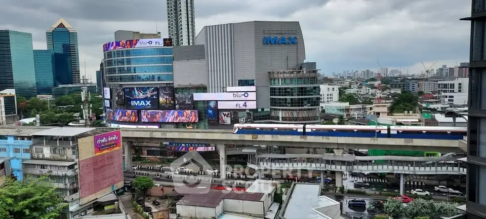 Stunning urban view of modern cityscape with high-rise buildings and train, perfect for real estate investment.