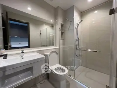 Modern bathroom with sleek design and glass shower enclosure