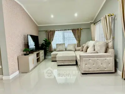 Elegant living room with plush sectional sofa and modern decor, perfect for relaxation and entertainment.