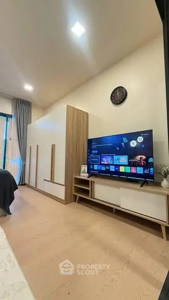 Modern living room with sleek TV setup and stylish decor
