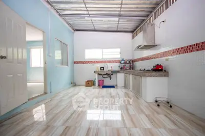 Spacious kitchen with open layout and modern appliances