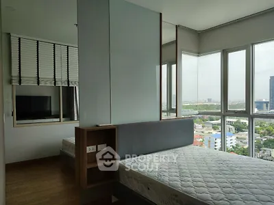Modern bedroom with panoramic city view and large windows