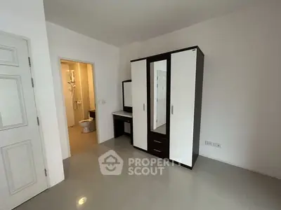 Spacious bedroom with modern wardrobe and ensuite bathroom