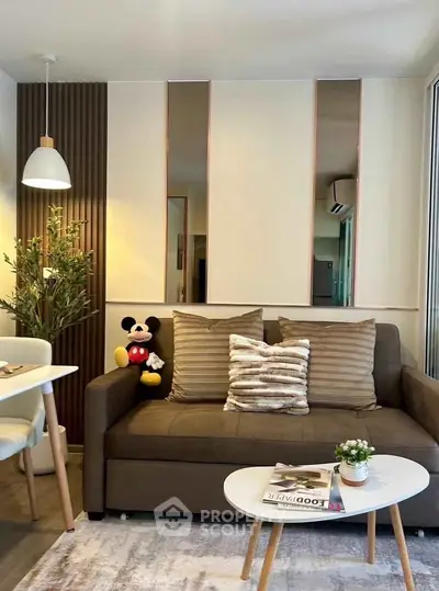 Chic modern living room with cozy sofa, stylish decor, and inviting ambiance for ultimate relaxation.