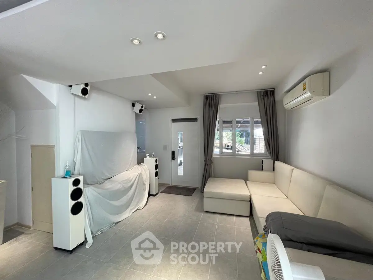 Spacious living room with modern decor and natural light