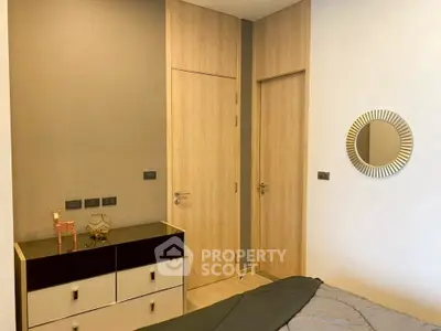 Modern bedroom with stylish decor and wooden accents