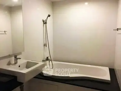 Modern bathroom with sleek bathtub and elegant fixtures