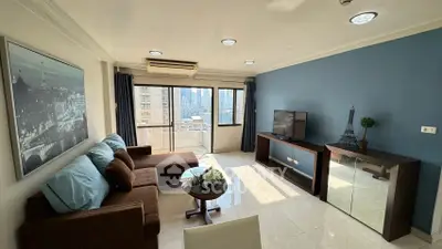 Spacious living room with modern decor and city view balcony