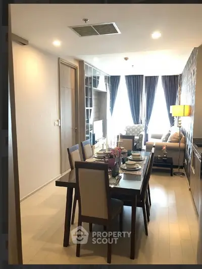 Modern dining and living area with elegant decor and natural light