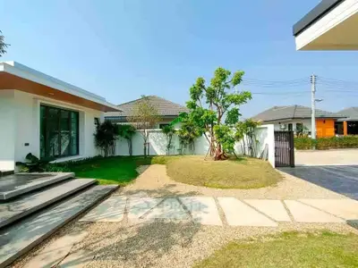 Modern home exterior with lush garden and stylish entrance