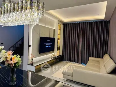 Luxurious modern living room with elegant chandelier and sleek furniture