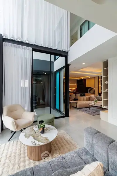 Luxurious modern living room with high ceilings and elegant decor