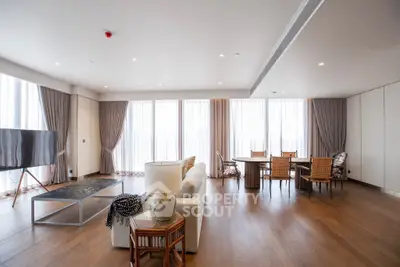 Spacious modern living room with elegant decor and large windows