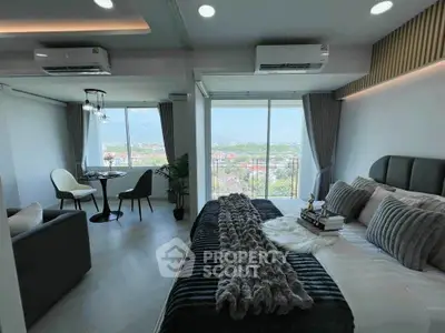 Luxurious modern bedroom with stunning view and cozy decor