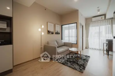 Modern living room with cozy sofa and stylish decor in a bright apartment.