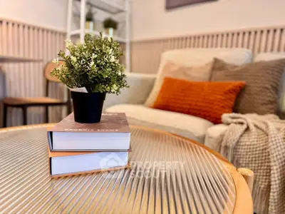 Cozy living room with stylish decor and comfortable seating, perfect for relaxation.