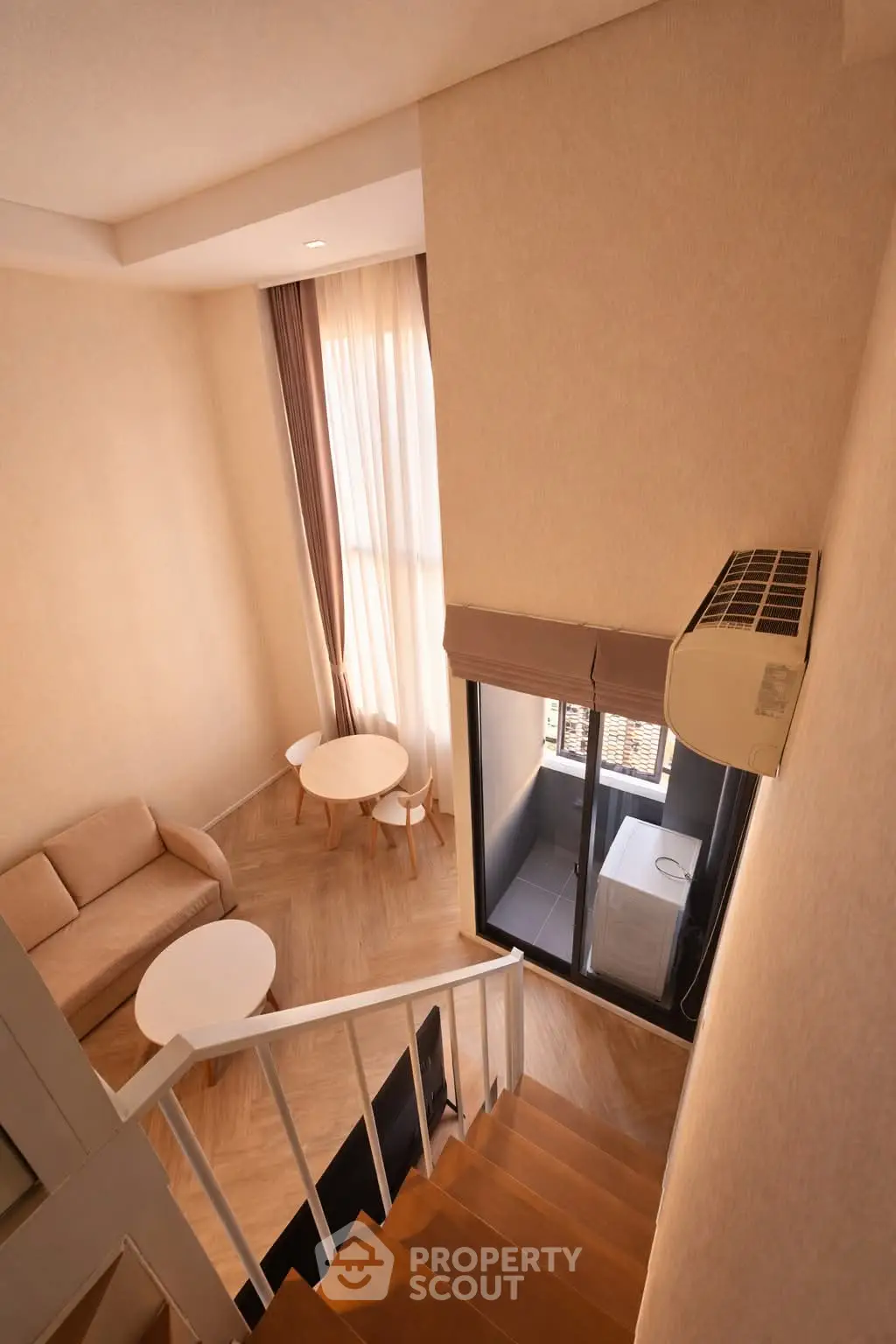 Modern duplex apartment with cozy living area and large windows