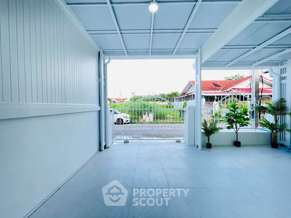 Spacious covered parking area with modern design and street view