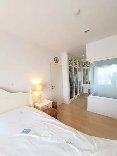 Bright bedroom with elegant decor and spacious wardrobe