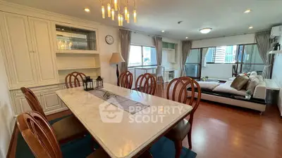 Spacious dining and living area with elegant decor and city view, perfect for entertaining.