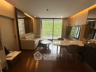 Modern living room with large window and stylish furniture