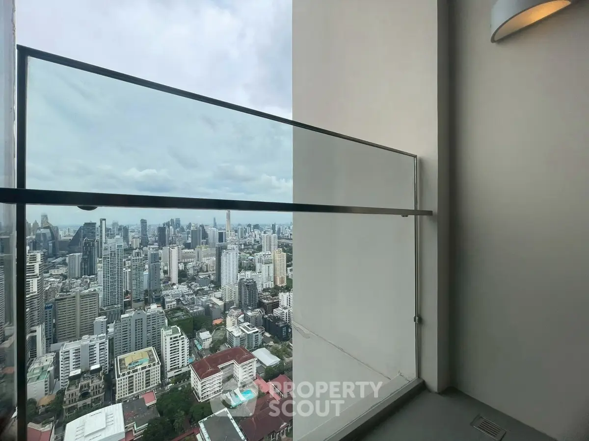 Stunning cityscape view from a modern high-rise balcony, perfect for urban living.