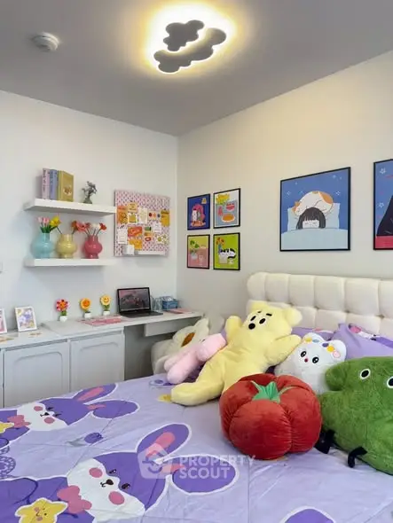 Charming bedroom with playful decor and plush toys, perfect for a child's room.