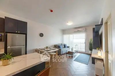 Modern open-plan living room with dining area and balcony access