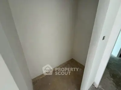 Compact storage space with tiled floor in a modern building