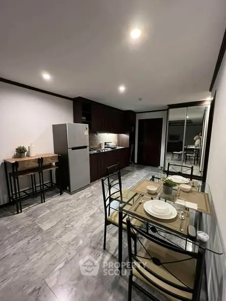 Modern kitchen and dining area with sleek design and stylish furniture