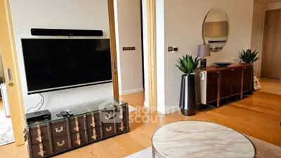 Modern living room with stylish decor and large TV setup