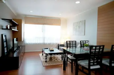 Spacious modern living room with dining area and natural light