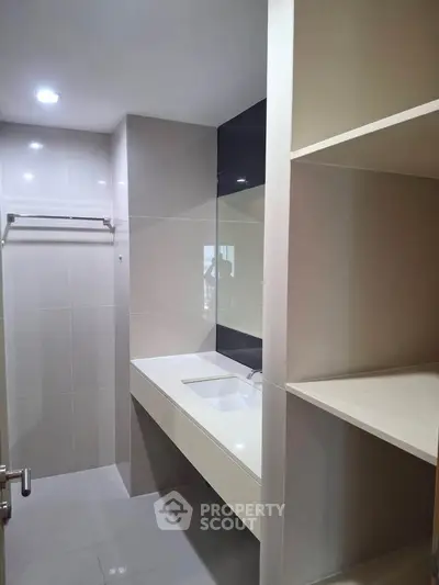 Modern bathroom with sleek design and ample storage space