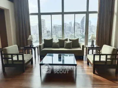 Luxurious living room with stunning city skyline view, elegant furniture, and floor-to-ceiling windows.