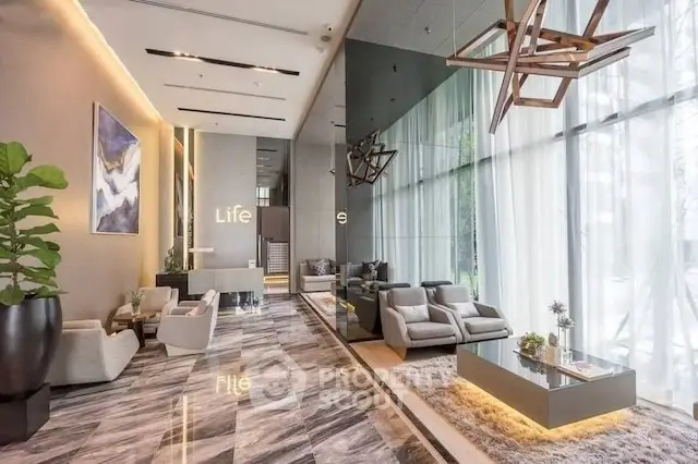 Luxurious modern living room with elegant decor and floor-to-ceiling windows.