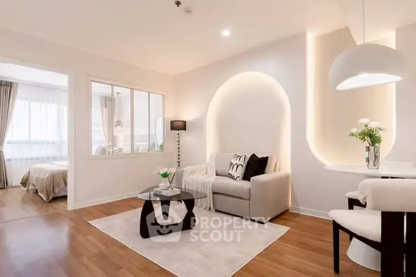 Elegant modern living room with cozy seating and stylish decor, perfect for relaxation and entertaining.