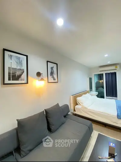 Modern studio apartment with cozy living area and stylish decor