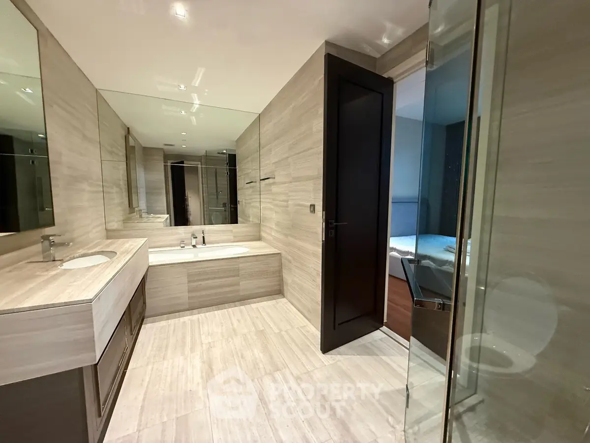 Luxurious modern bathroom with elegant fixtures and spacious layout in upscale property.