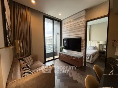Modern living room with stylish decor and adjacent bedroom in luxury apartment