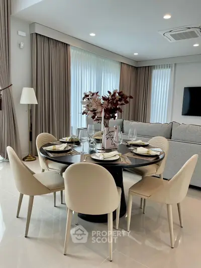 Elegant dining area with modern decor and natural light