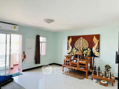 Spacious living room with balcony access and unique decorative elements
