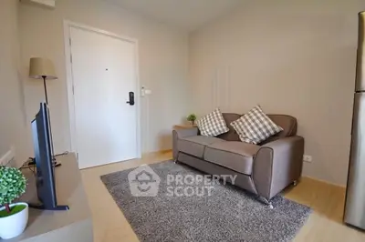 Cozy living room with modern decor and comfortable seating in a stylish apartment.