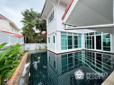 Luxurious modern home with private pool and lush garden, perfect for relaxation and entertaining.